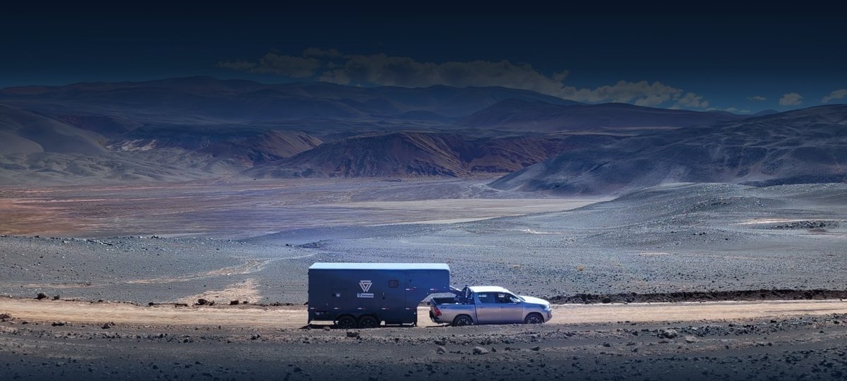 A Puna field rig pulling a sampling trailer across a Lithium Triangle salar — built from the ground up across Argentina, Bolivia, Chile, Canada and the USA.
